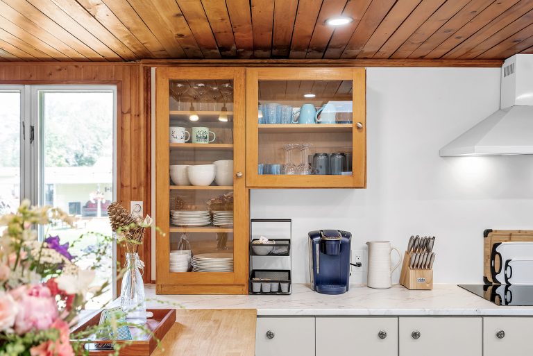 cabinet in kitchen with dishes