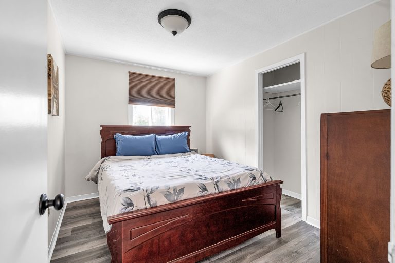 front view bedroom with 1 queen bed