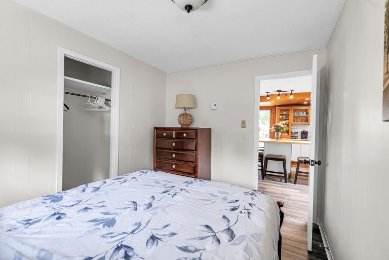 back view bedroom with 1 queen bed