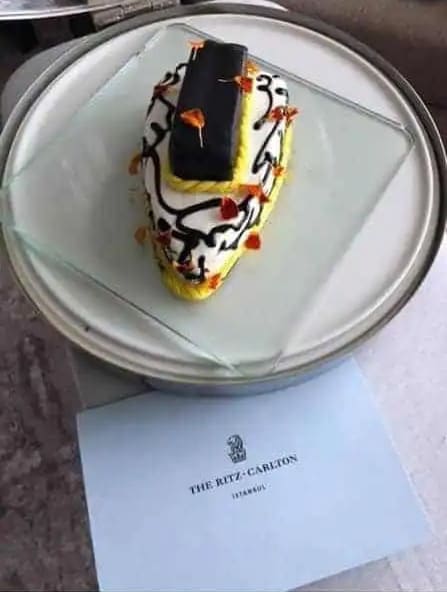 Graphic of a cake as one of the Ritz-Carlton hotel welcome gifts.