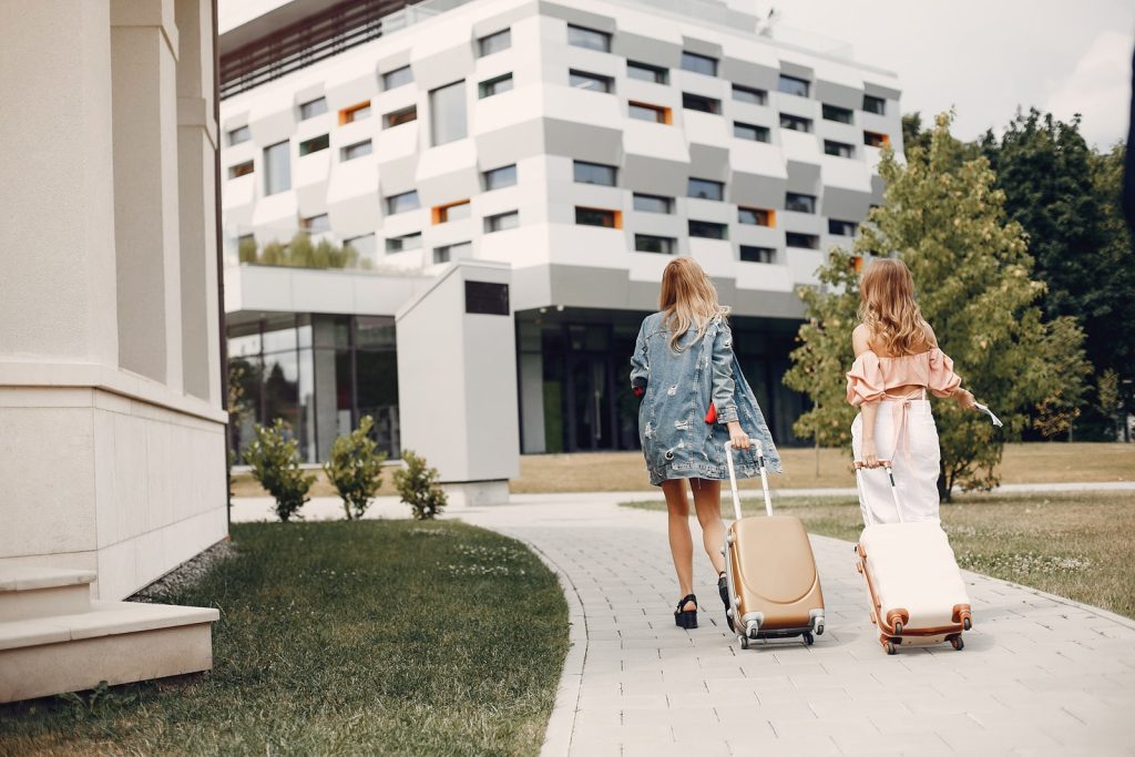 Picture of two women going to check into the hotel.