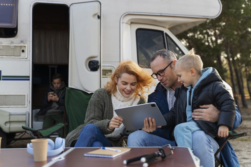 Portrait of a family who rented out an RV used in the comparison of Outdoorsy vs RVShare.